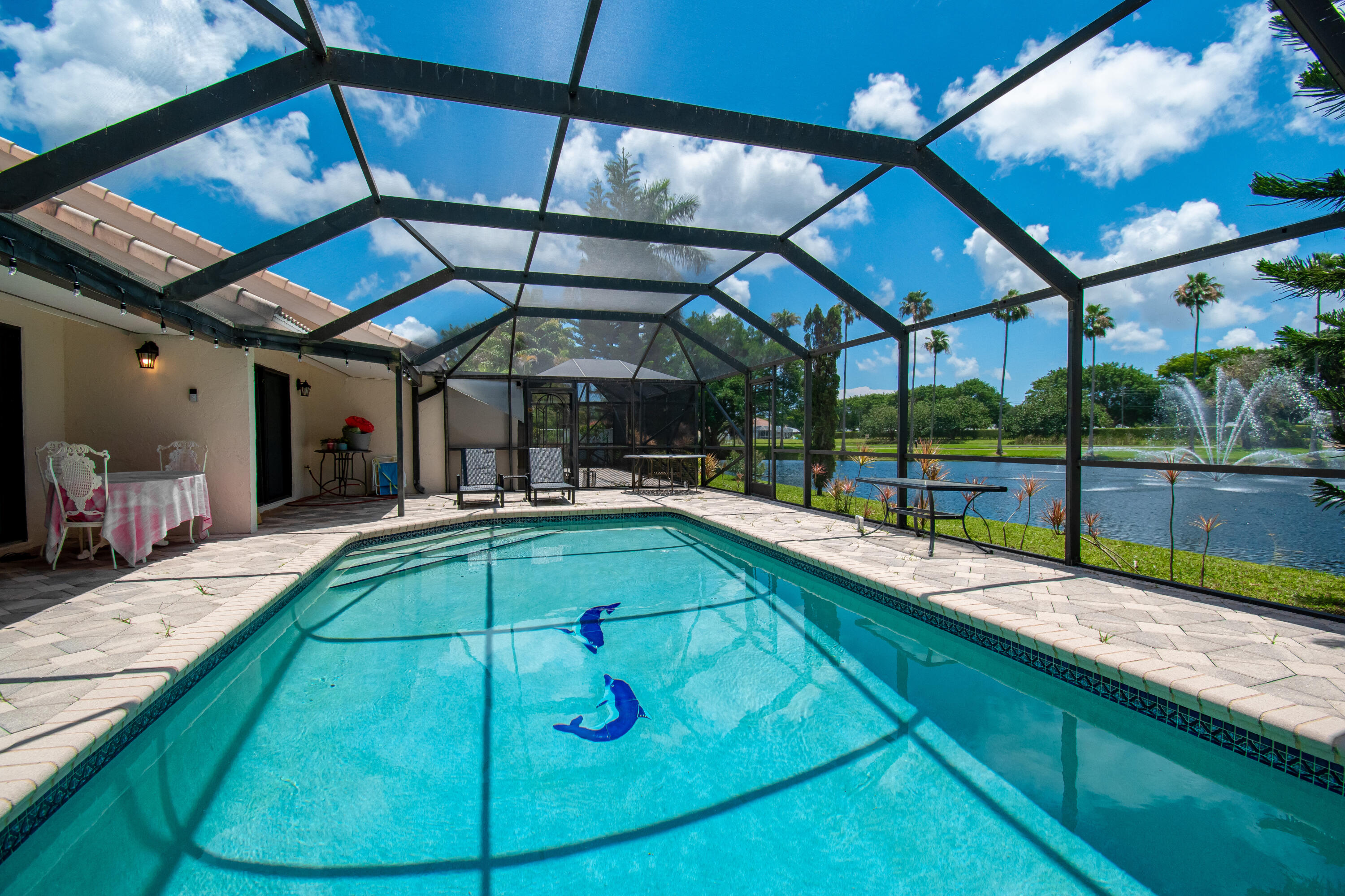 9708 Erica Court Boca Raton, FL 33496 - Photo 39 of 54 a view of a backyard with a swimming pool
