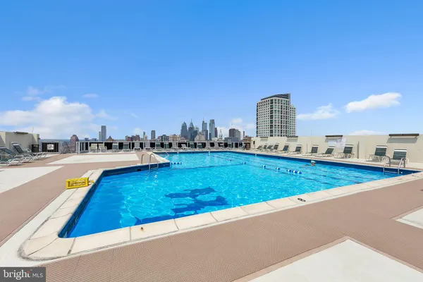a view of a swimming pool and a yard