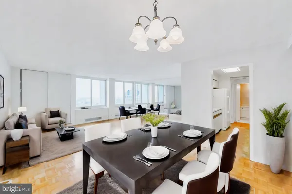 a view of a dining room and livingroom with furniture