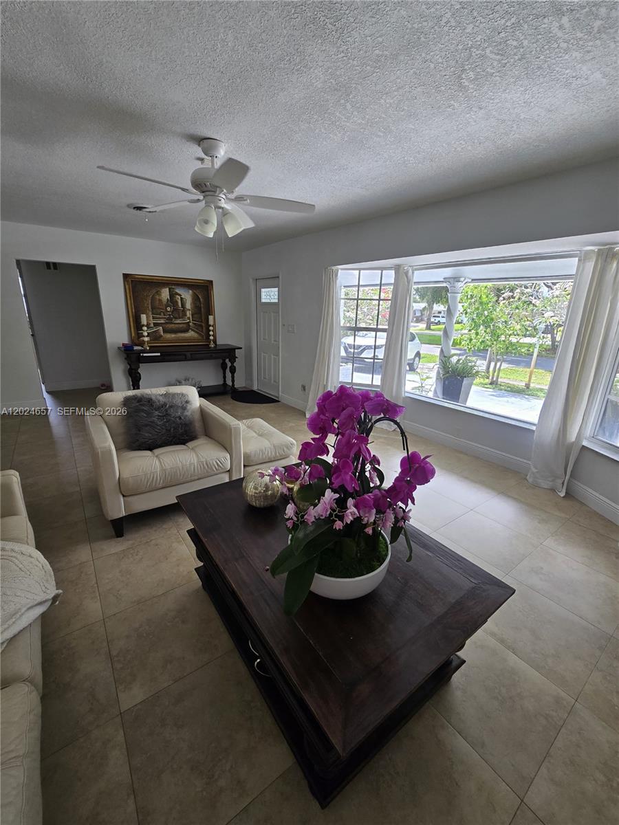 3619 West Park Road Hollywood, FL 33021 - Photo 17 of 19 a living room with furniture and a fireplace