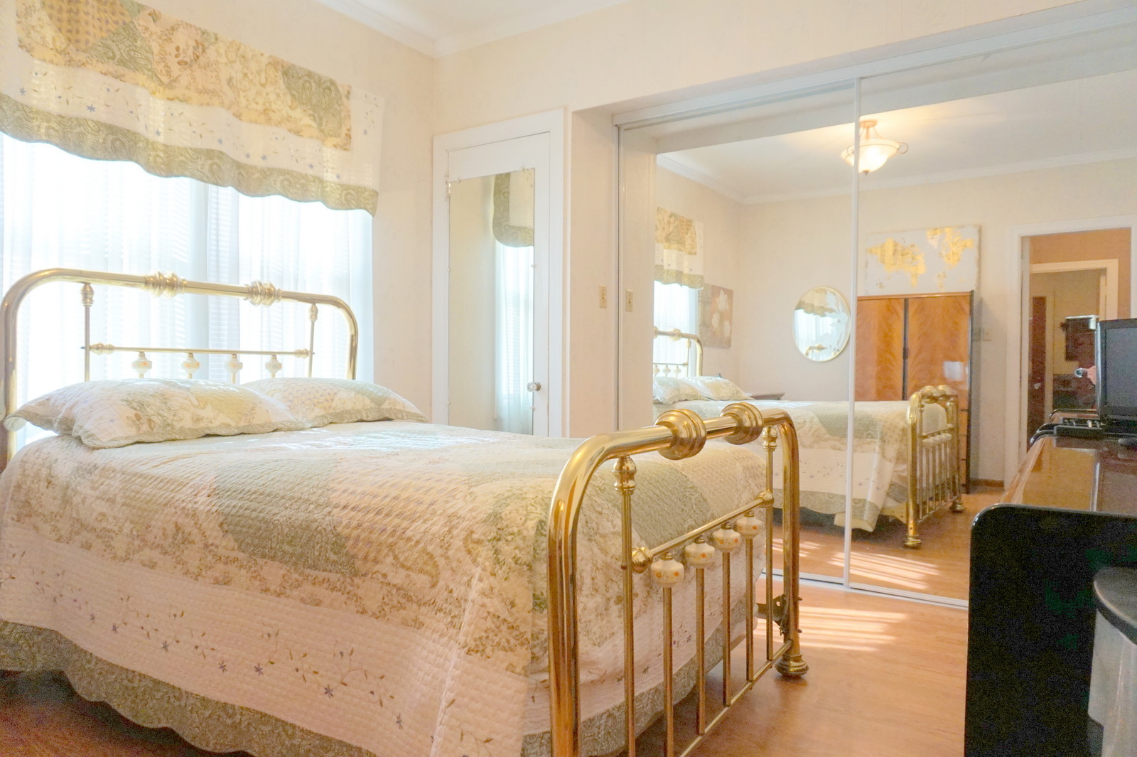 807 Black Road Joliet, IL 60435 - Photo 14 of 30 a bedroom with a large bed and a large window