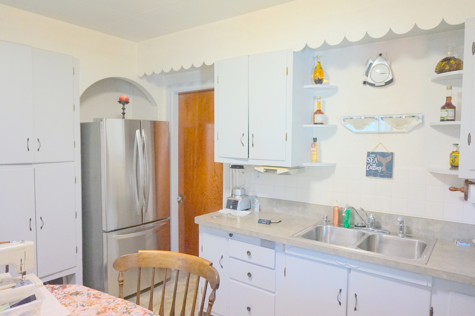 807 Black Road Joliet, IL 60435 - Photo 22 of 30 a kitchen with a sink a refrigerator and a cabinets