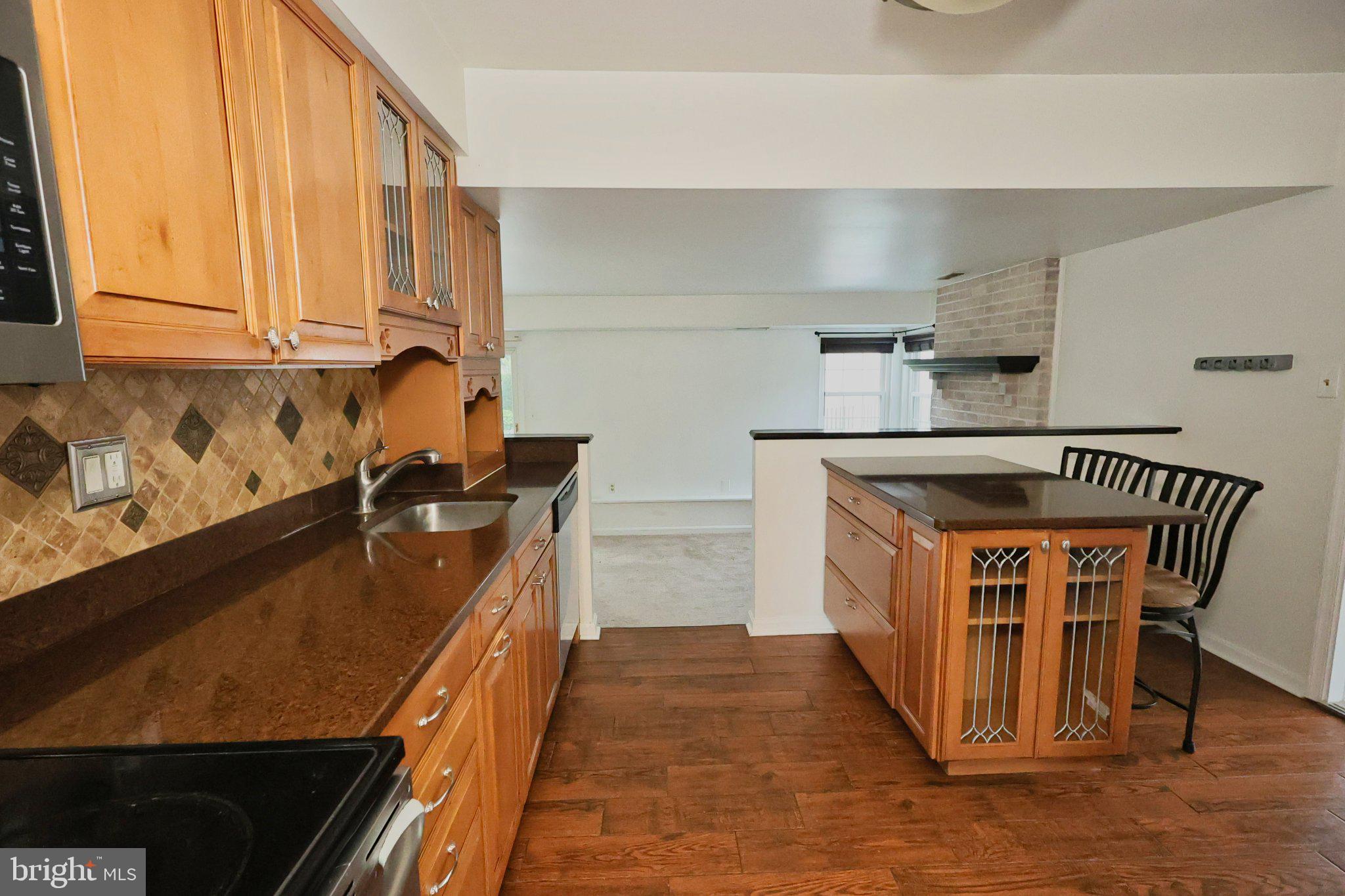 4402 Fieldgreen Road Nottingham, MD 21236 - Photo 20 of 52 Modern kitchen with warm wood accents.