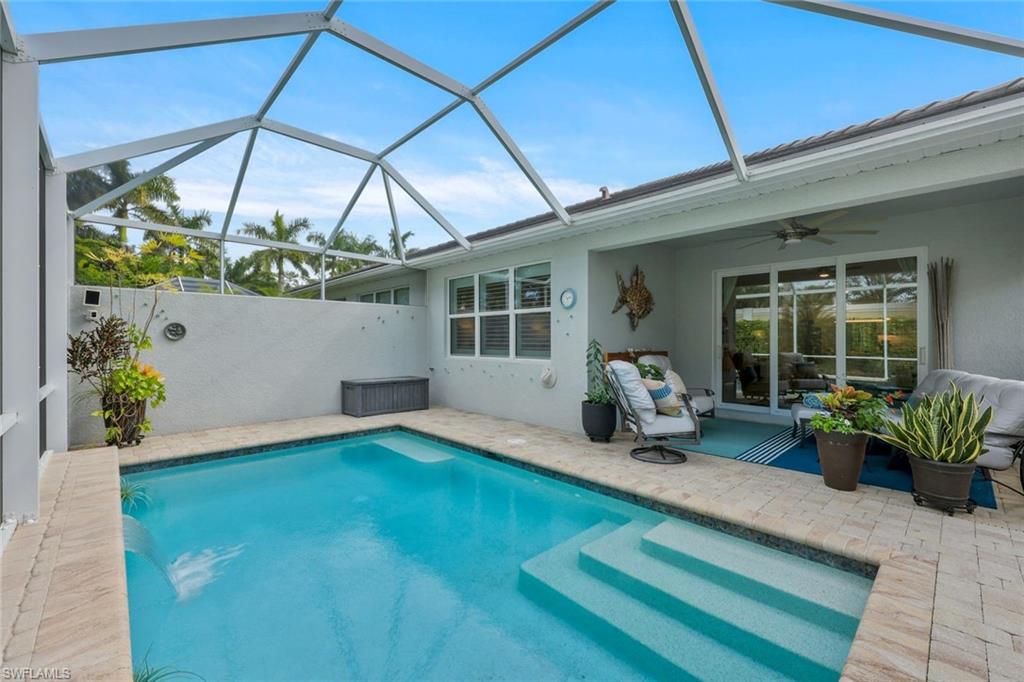 10787 Manatee Key Lane Estero, FL 33928 - Photo 2 of 31 a front view of a house with patio