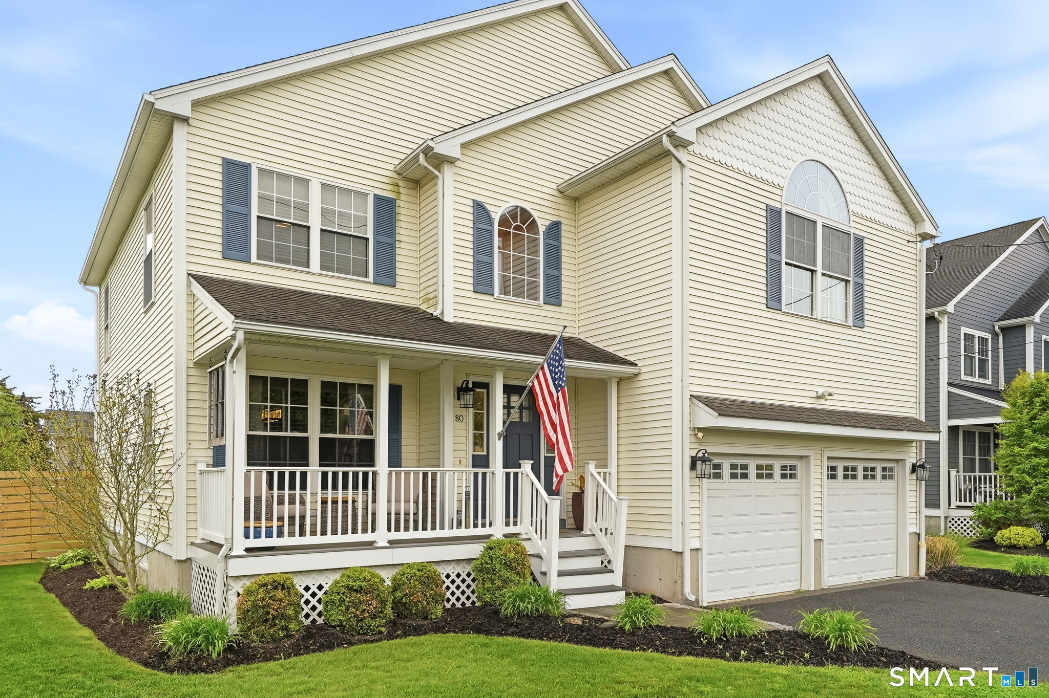 80 3rd Avenue Stratford, CT 06615 - Photo 2 of 40 a front view of a house with a yard and plants