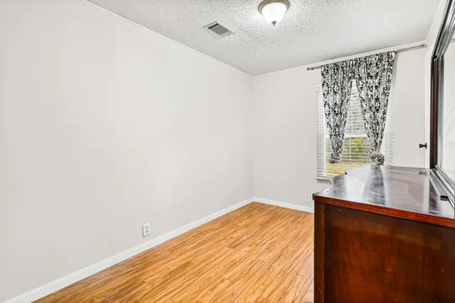 a room with a bed and a window