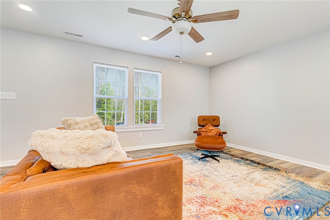5301 Pine Fork Road Quinton, VA 23141 - Photo 13 of 41 a bedroom with a bed and wooden floor