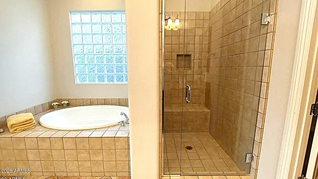 a view of a kitchen with a table and chairs