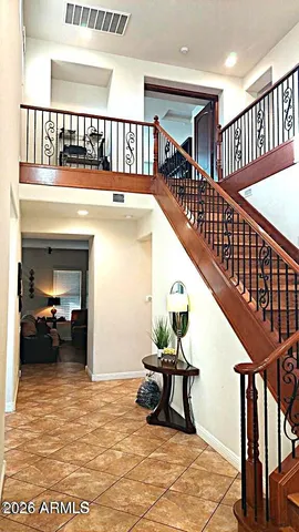 a spacious bedroom with a bed and window