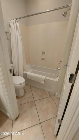 a kitchen with granite countertop cabinets and white appliances
