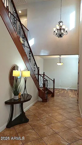 a view of a a dining room with furniture window and wooden floor