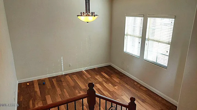 a kitchen with counter top space and wooden floor