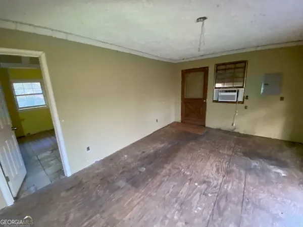 a view of an empty room with a fireplace