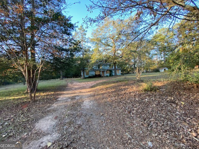 3011 Clack Road Madison, GA 30650 - Photo 25 of 27 a view of a yard with large trees