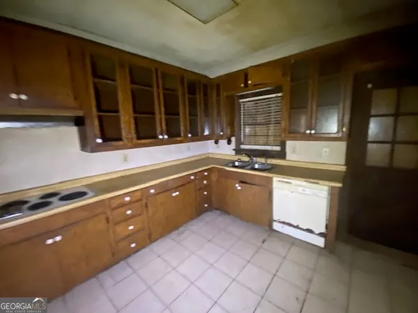 a kitchen with a sink and cabinets