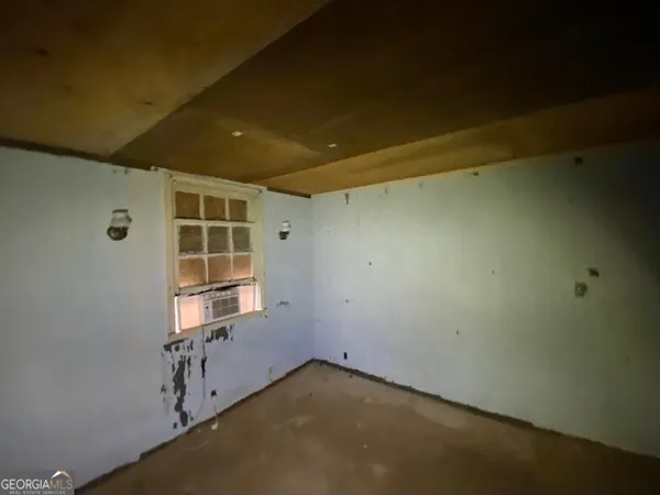 a bathroom with a shower and a toilet