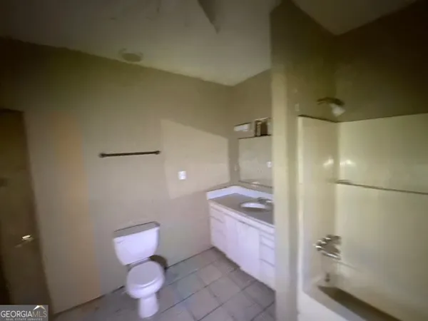 a bathroom with a sink and a toilet