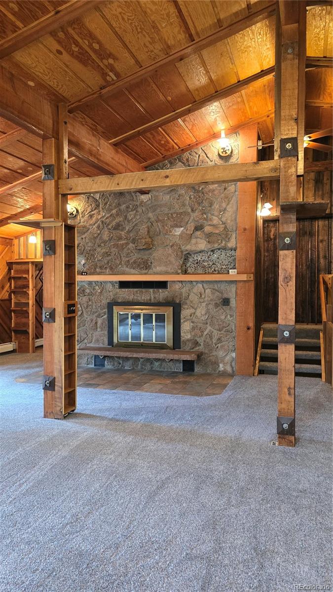 Undisclosed Address Nathrop, CO 81236 - Photo 13 of 50 a view of empty room with wooden floor and fireplace
