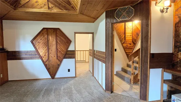 a room with lots of wooden furniture