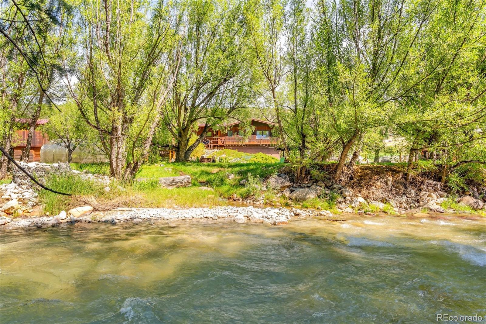 Undisclosed Address Nathrop, CO 81236 - Photo 4 of 50 a view of a yard with large trees