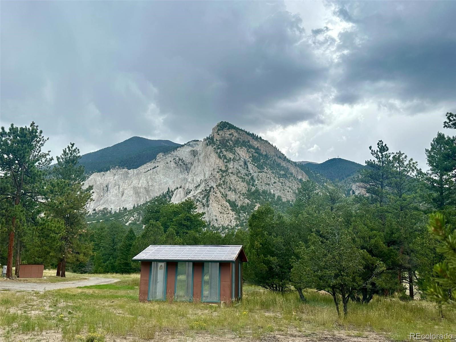 Undisclosed Address Nathrop, CO 81236 - Photo 49 of 50 a view of a garden with a building in the background