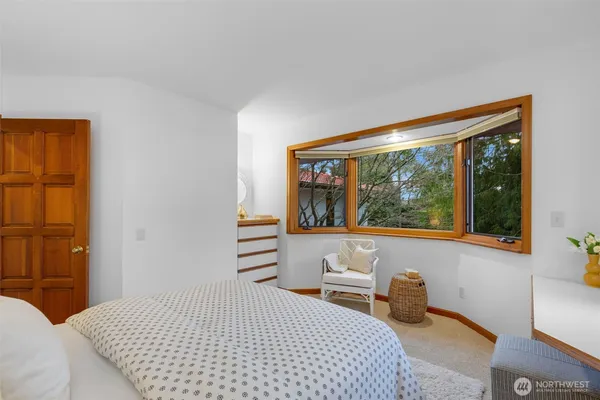 a bedroom with a bed and a couch