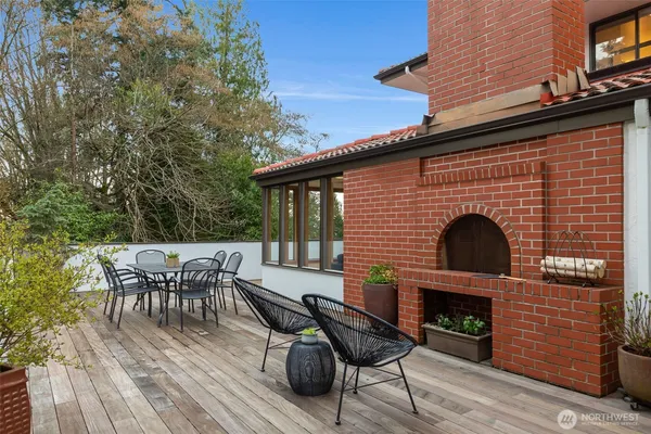 a view of a house with backyard sitting area and garden