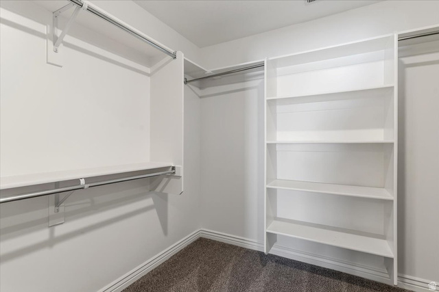2028 West Grace Way Layton, UT 84041 - Photo 17 of 36 Walk in closet featuring dark colored carpet