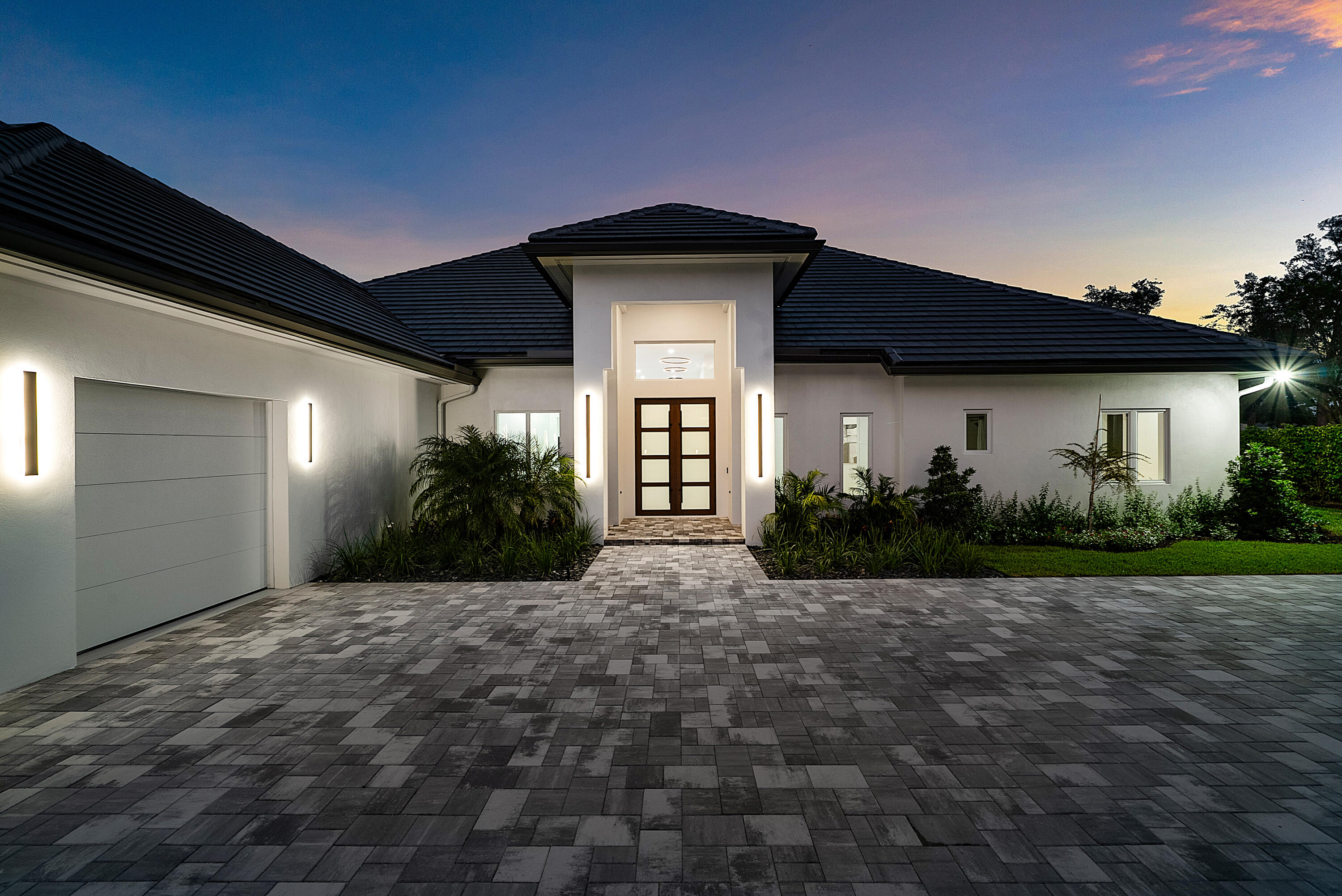 100 Glenbrook Court Atlantis, FL 33462 - Photo 11 of 97 a view of a house with a yard