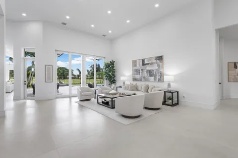 a view of kitchen with sink microwave refrigerator and cabinets