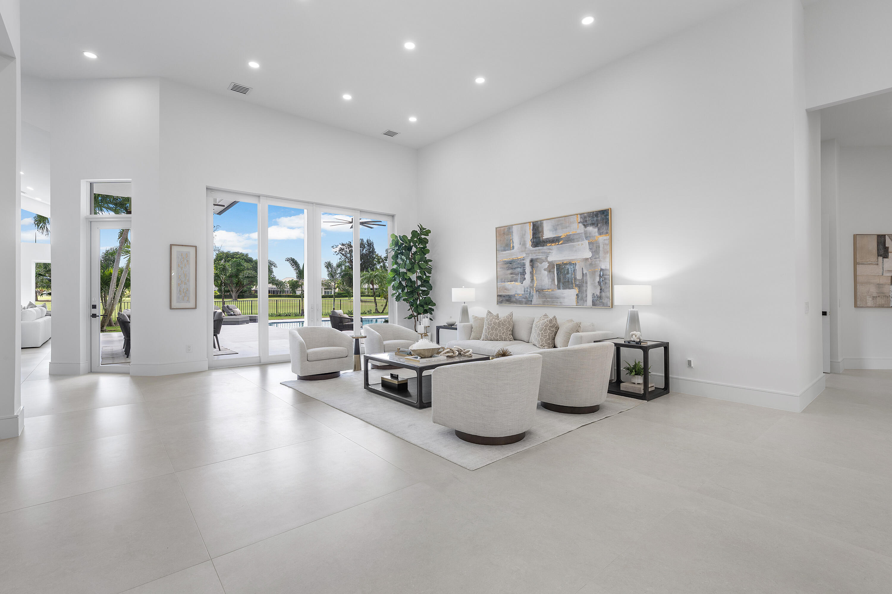 100 Glenbrook Court Atlantis, FL 33462 - Photo 18 of 97 a living room with furniture and a large window