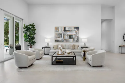 a large kitchen with a table and chairs in it