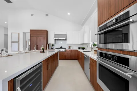 a bedroom with bed and a potted plant