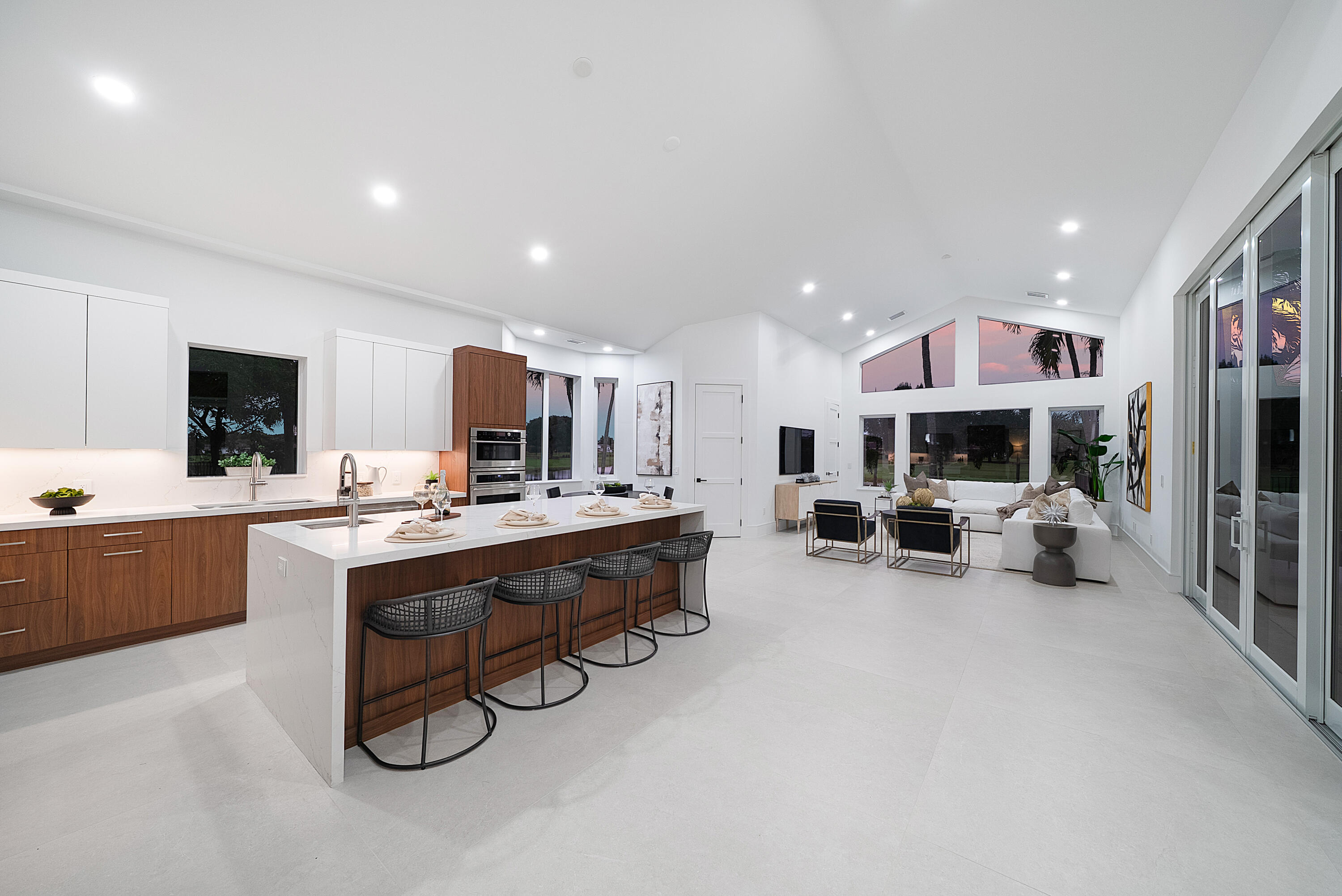 100 Glenbrook Court Atlantis, FL 33462 - Photo 30 of 97 a large kitchen with a table and chairs in it