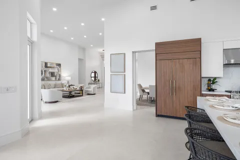 a dining room with furniture a garden and balcony