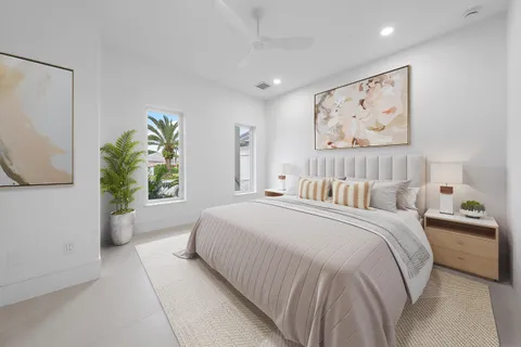 a living room with fireplace furniture and a potted plant