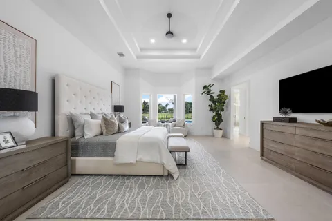 an aerial view of residential houses with outdoor space and swimming pool