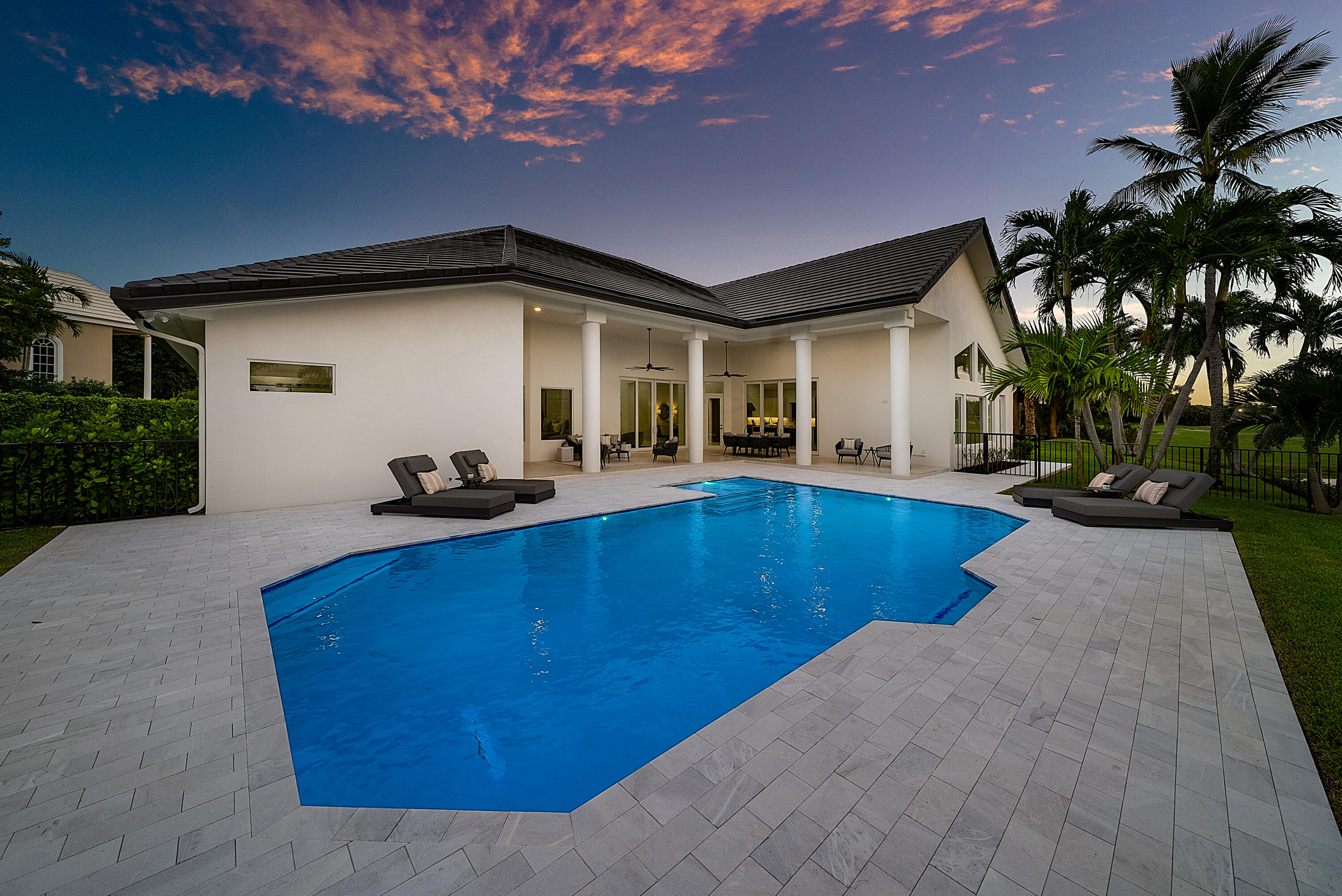 100 Glenbrook Court Atlantis, FL 33462 - Photo 71 of 97 a front view of house with yard and outdoor seating