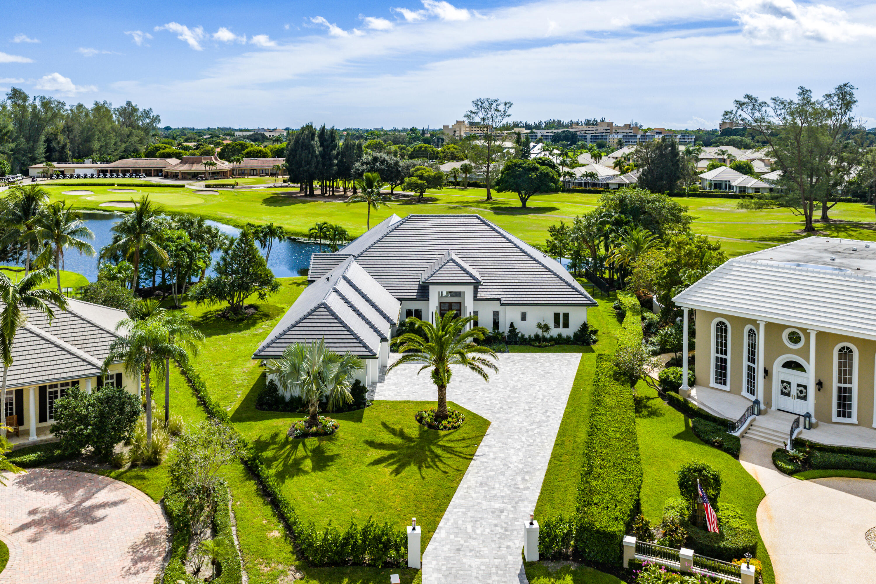 100 Glenbrook Court Atlantis, FL 33462 - Photo 95 of 97 a view of swimming pool with outdoor seating and yard in back