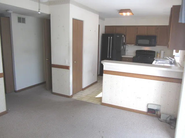 a view of a kitchen with a sink