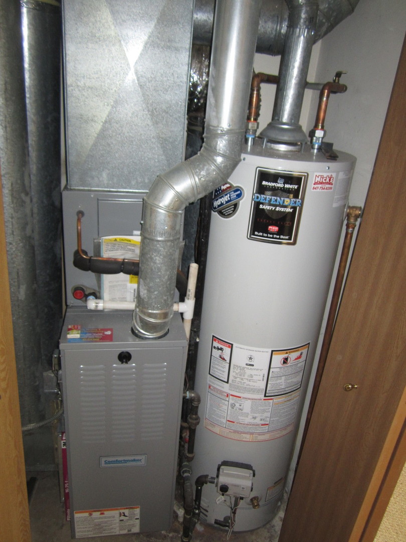 28 North Oltendorf Road Streamwood, IL 60107 - Photo 8 of 11 a view of water heater room with washer and dryer
