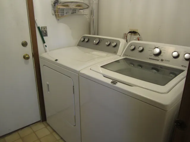 a utility room with dryer and washer