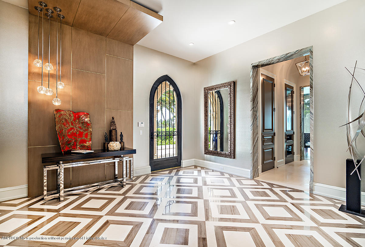 8 Golfview Road Palm Beach, FL 33480 - Photo 17 of 61 a view of a living room with a flat screen tv and floor to ceiling window
