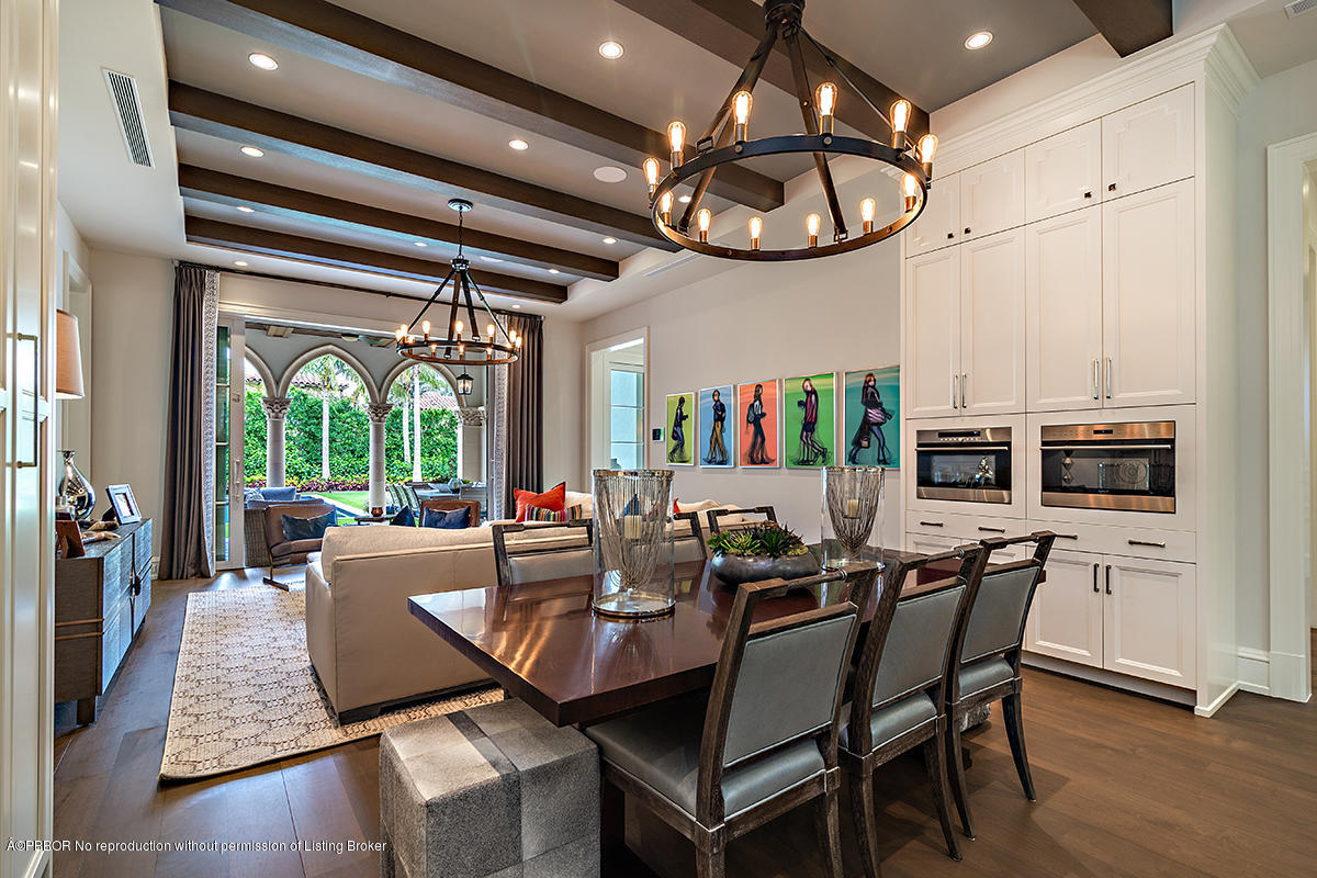 8 Golfview Road Palm Beach, FL 33480 - Photo 22 of 61 a view of a dining room with furniture wooden floor and chandelier