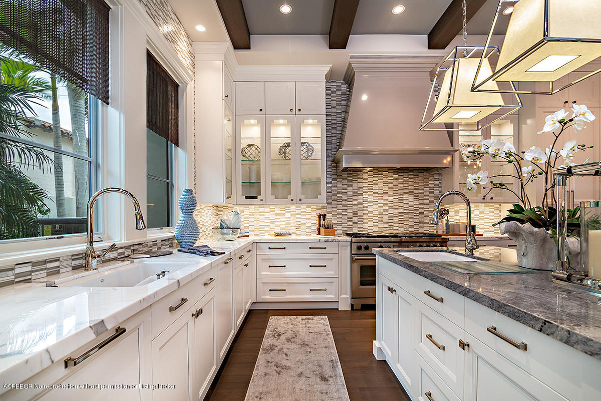 8 Golfview Road Palm Beach, FL 33480 - Photo 26 of 61 a large kitchen with stainless steel appliances granite countertop a sink stove and cabinets