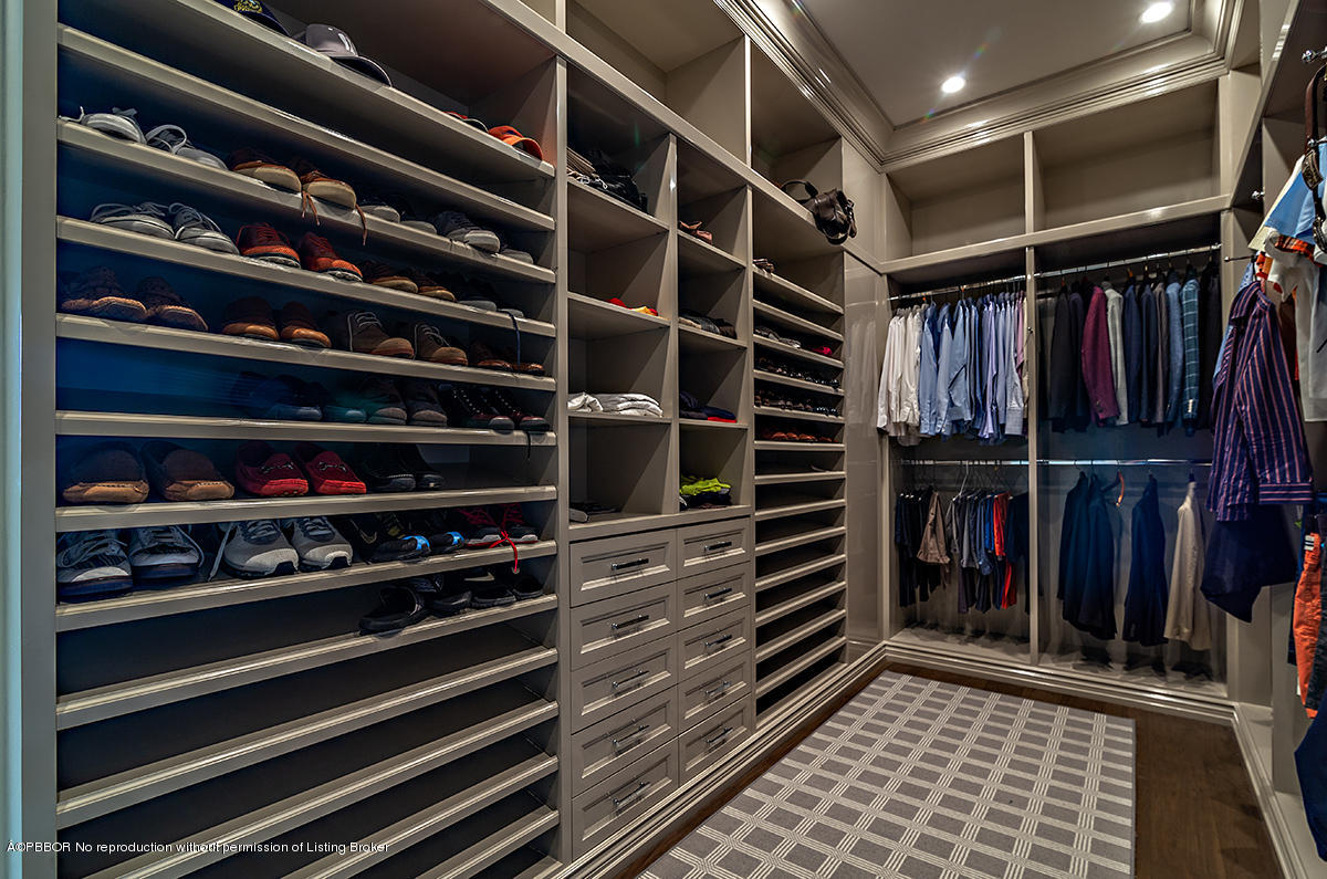 8 Golfview Road Palm Beach, FL 33480 - Photo 34 of 61 a view of walk in closet with clothes and shoes