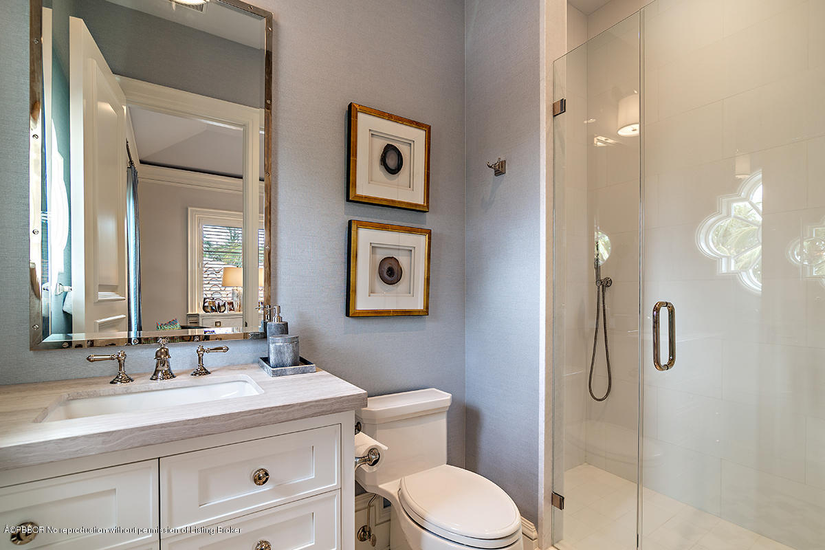 8 Golfview Road Palm Beach, FL 33480 - Photo 36 of 61 a bathroom with a granite countertop sink a toilet and a mirror