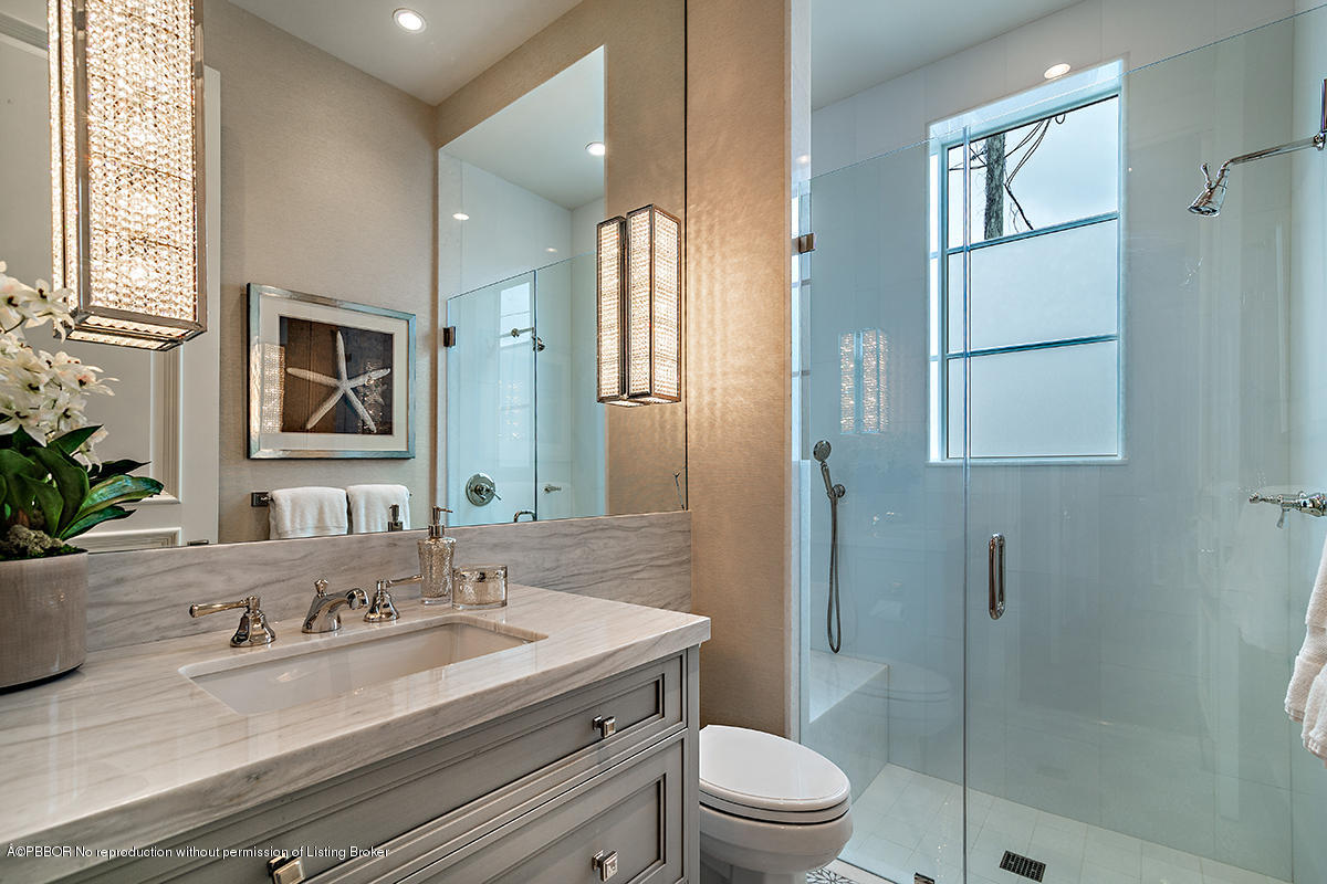 8 Golfview Road Palm Beach, FL 33480 - Photo 42 of 61 a bathroom with a granite countertop sink toilet and shower