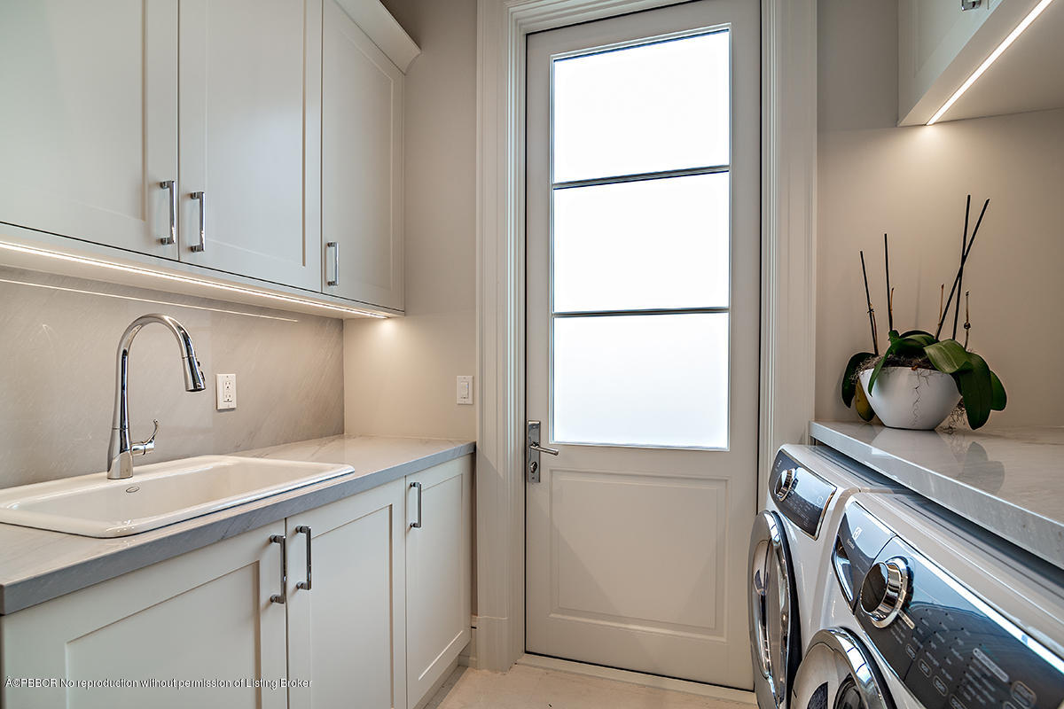 8 Golfview Road Palm Beach, FL 33480 - Photo 43 of 61 a kitchen with a sink and a refrigerator