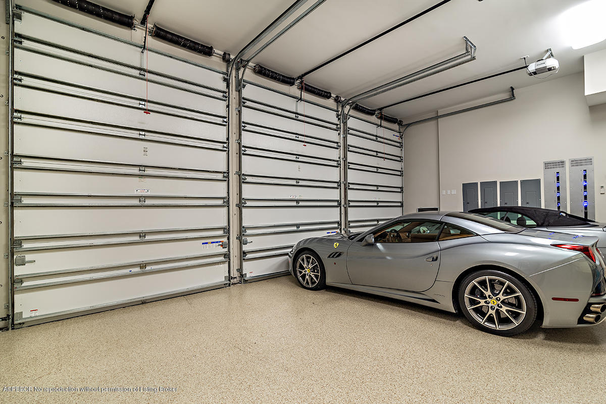 8 Golfview Road Palm Beach, FL 33480 - Photo 44 of 61 a view of garage with a car parked in it
